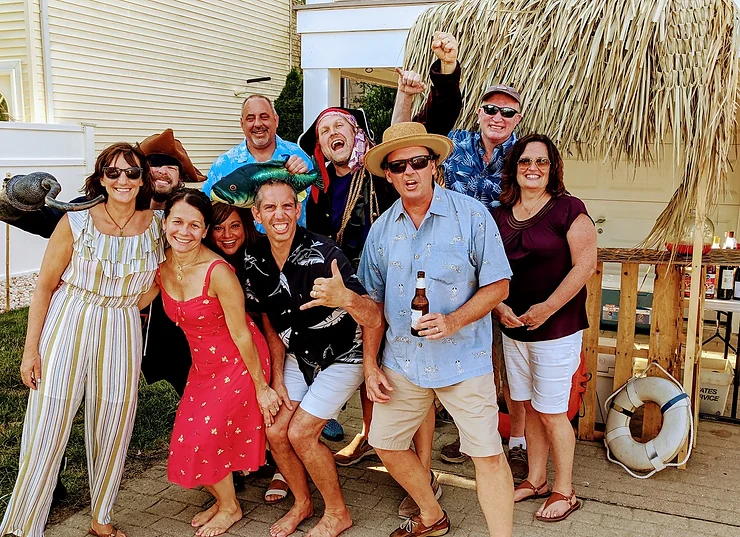 Pirate actors and guests sharing laughs and suspense at a themed murder mystery at the Jersey Shore