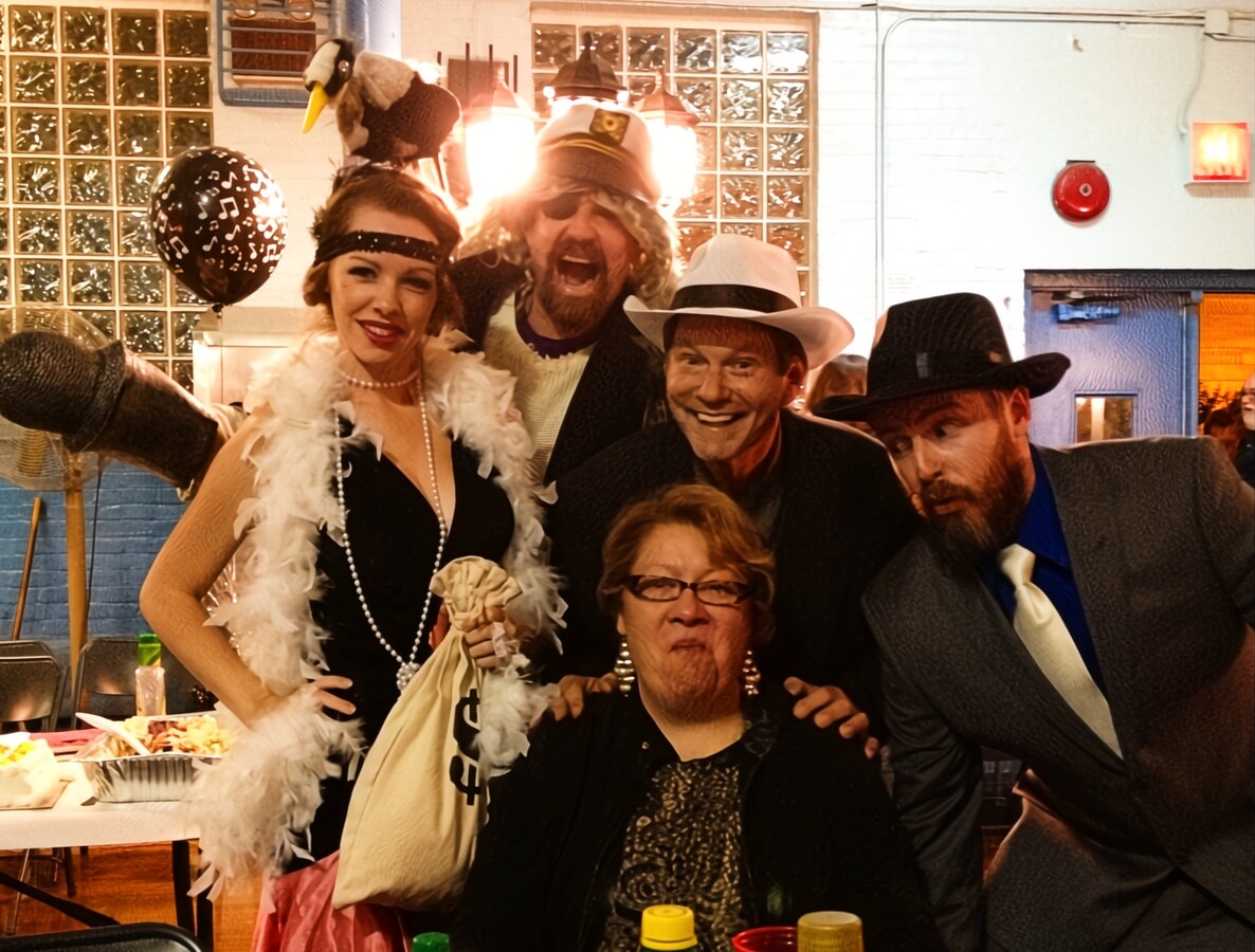 Flapper and gangster-clad actors hosting a unique sorority rush