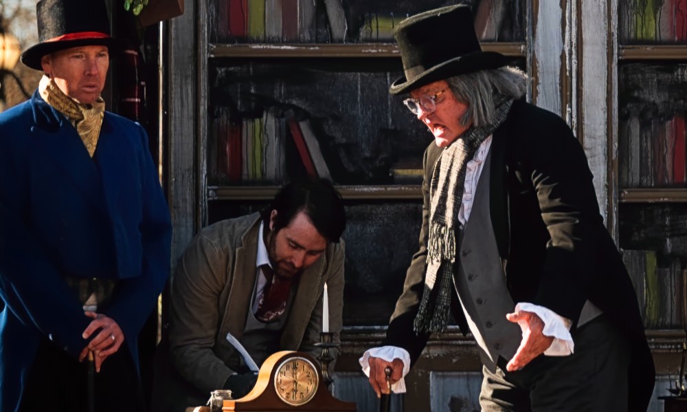 Victorian-dressed performers interacting with visitors at Smithville’s Dickens Fest