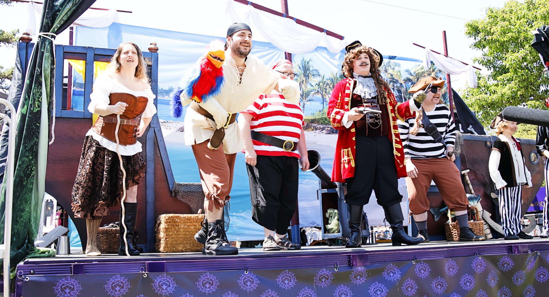 Actors in period costumes entertaining families with a lively performance at a South Jersey festival