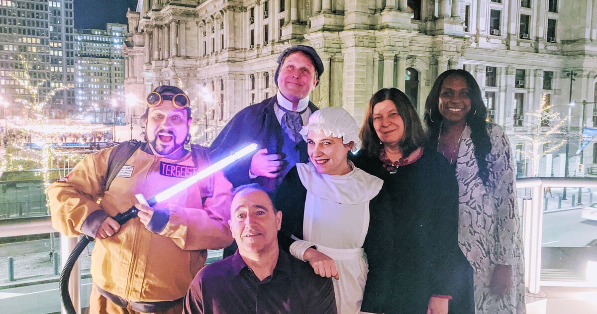 Detective-themed summer murder mystery event with guests solving clues