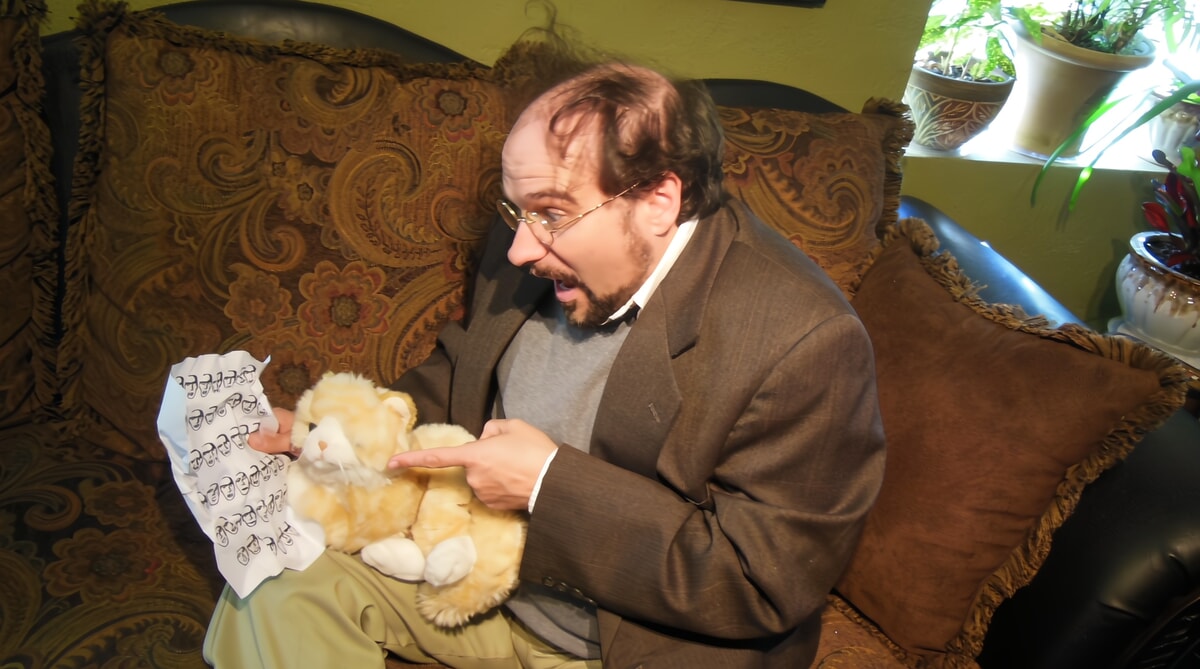 Professor T. Halberd sitting translating an ancient version of Aesop’s fables