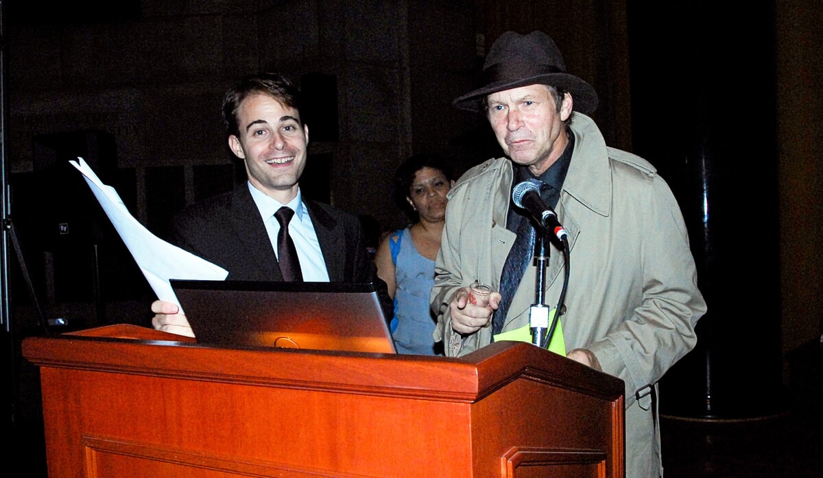 Ronald W Long actor playing a key role in a murder mystery production, drawing the audience into the story.
