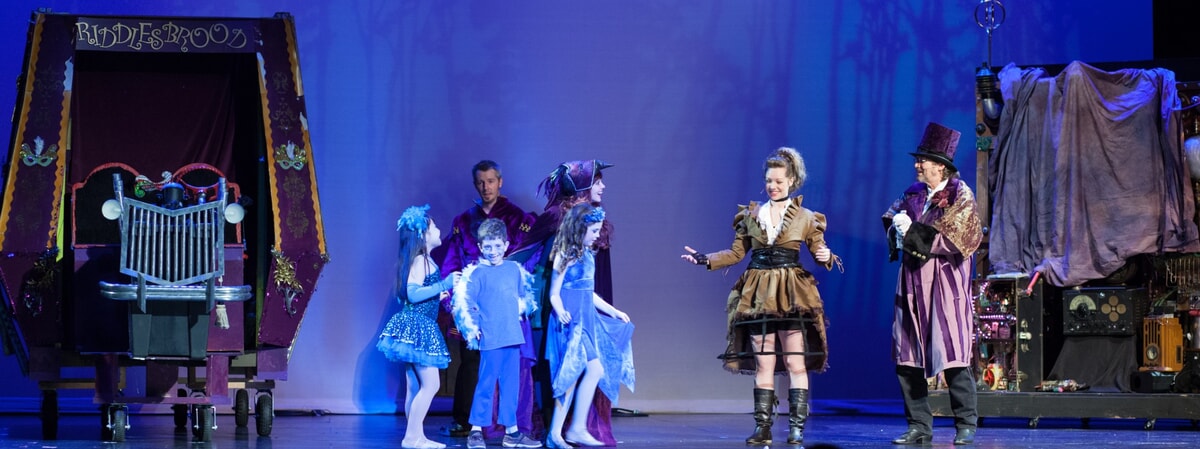 A majestic ensemble featuring delicate wings and shimmering fabrics, designed by Geryl Hickey