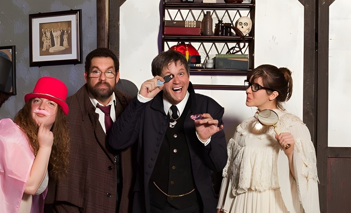 Ronald W Long actor immersed in a dramatic moment during a live theatrical murder mystery show