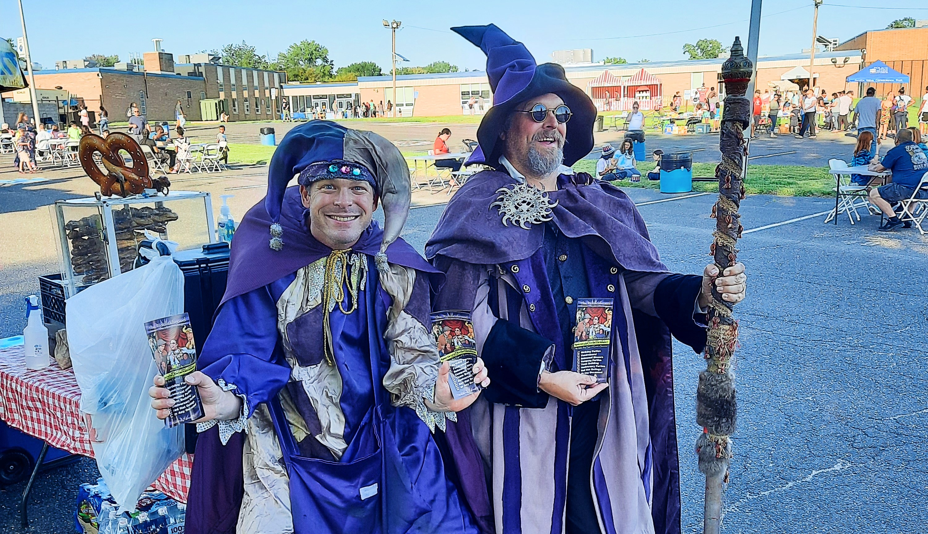 Actors performing an engaging theatrical show on an outdoor stage as part of an outdoor touring theater production