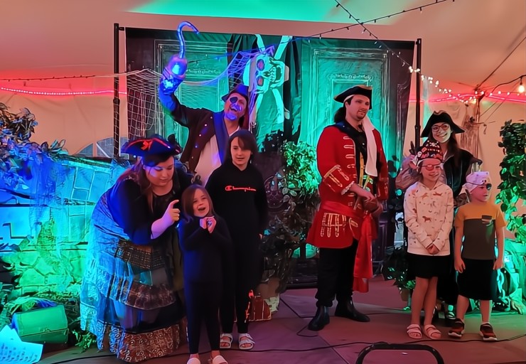 A group of actors dressed as pirates engaging guests in an interactive murder mystery at the Jersey Shore
