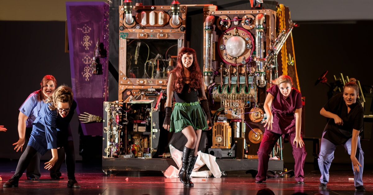Dramatic stage performance depicting an apocalyptic end-of-the-world show