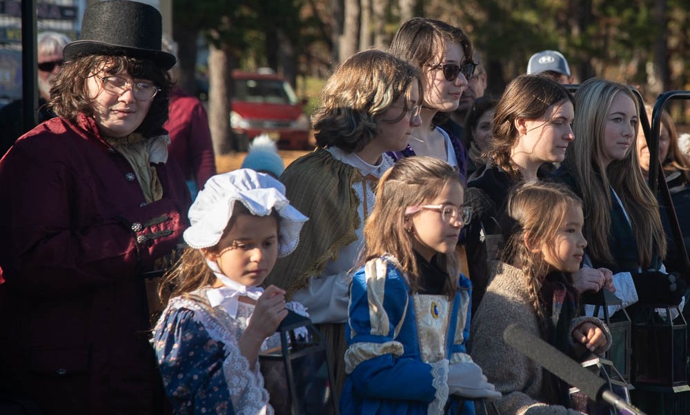 Theatrical performers in period costumes at Dickens Fest Historic Smithville