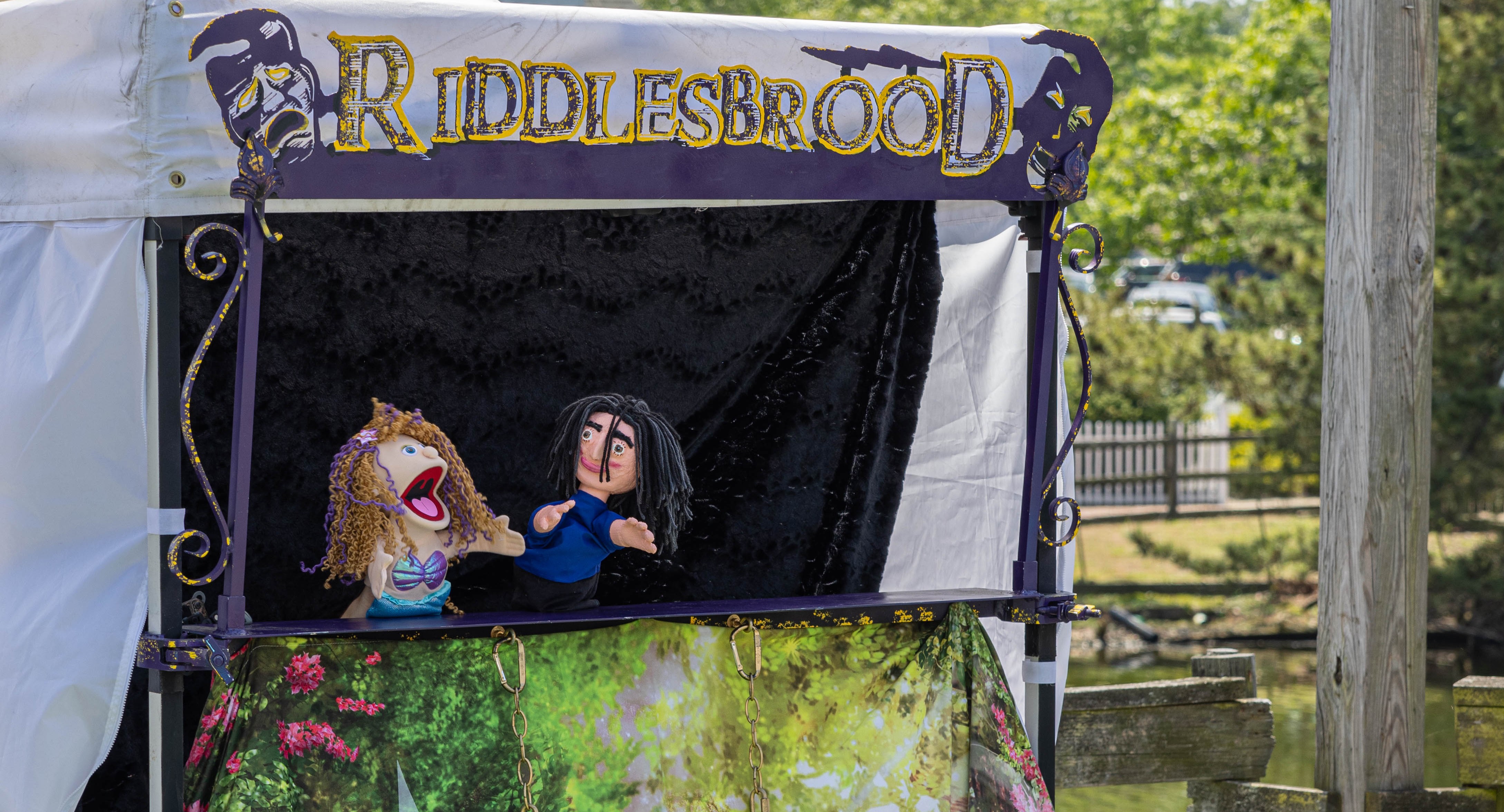 A vibrant display of handcrafted puppets from the kids' puppet show at Historic Smithville, ready to entertain children and families