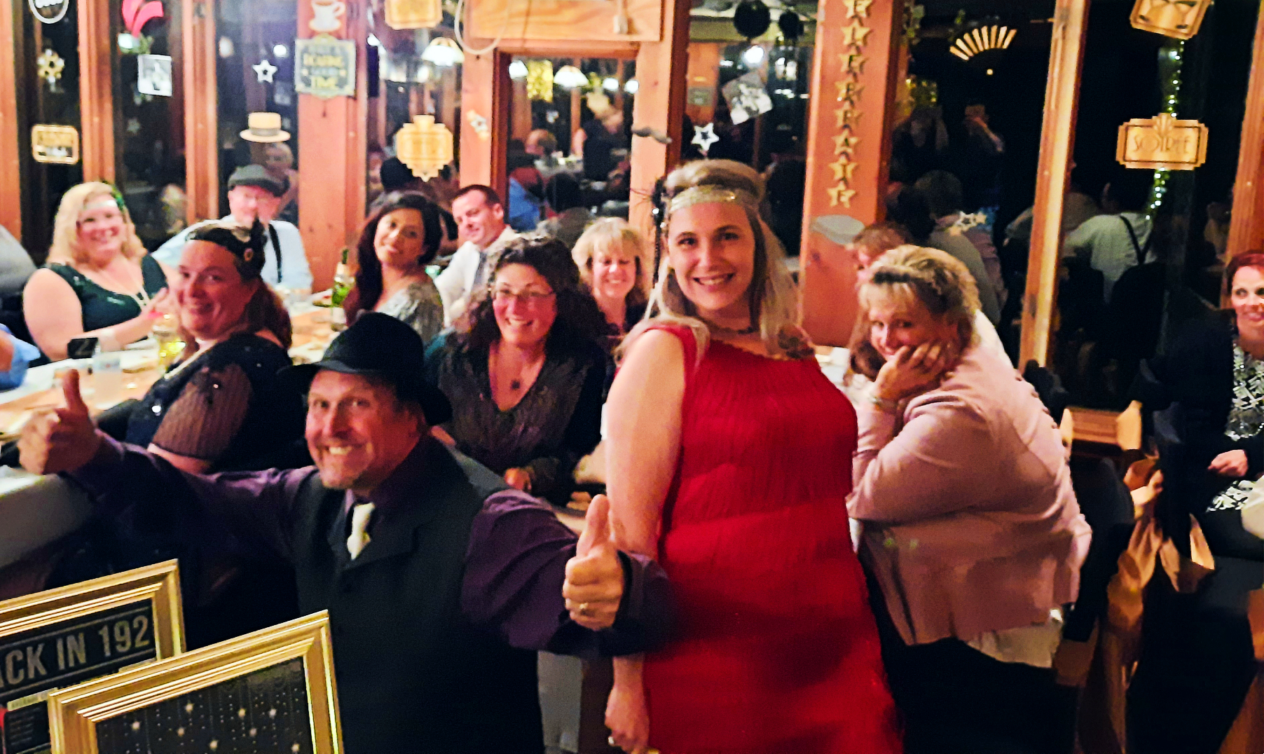 Actors and guests react with surprise as they uncover a major clue in a typical murder mystery party