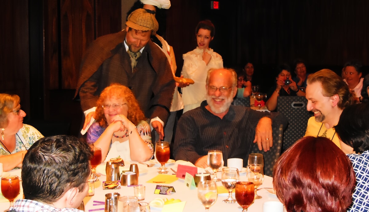 Writers collaborating on ideas during an interactive session at the Murder Mystery Writer’s Conference.
