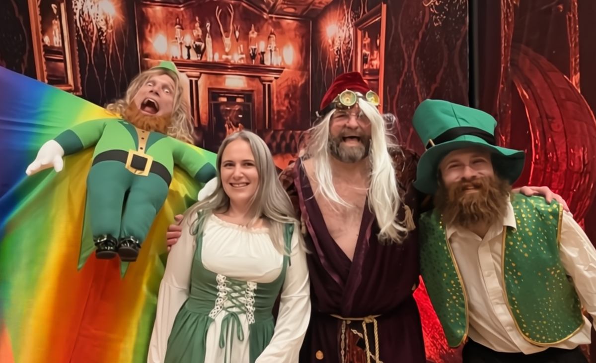 A leprechaun character smirking suspiciously in "The Four-Leaf Killer," a thrilling and hilarious Irish murder mystery event.