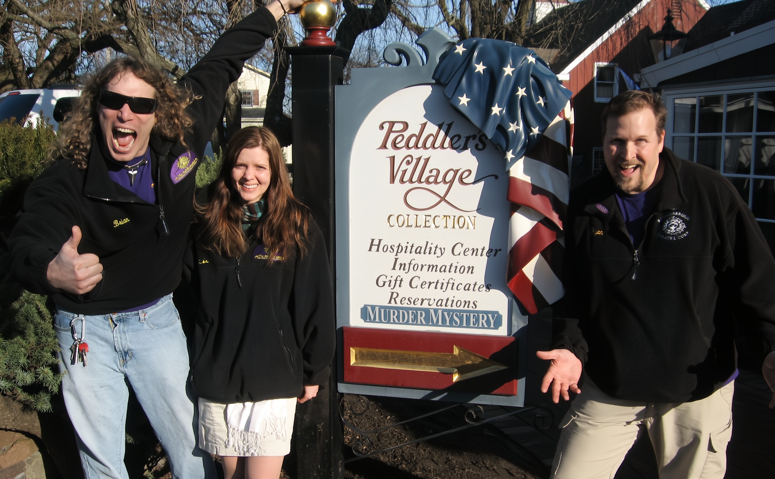 The Riddlesbrood Actors posing with the Peddlers Village Sign