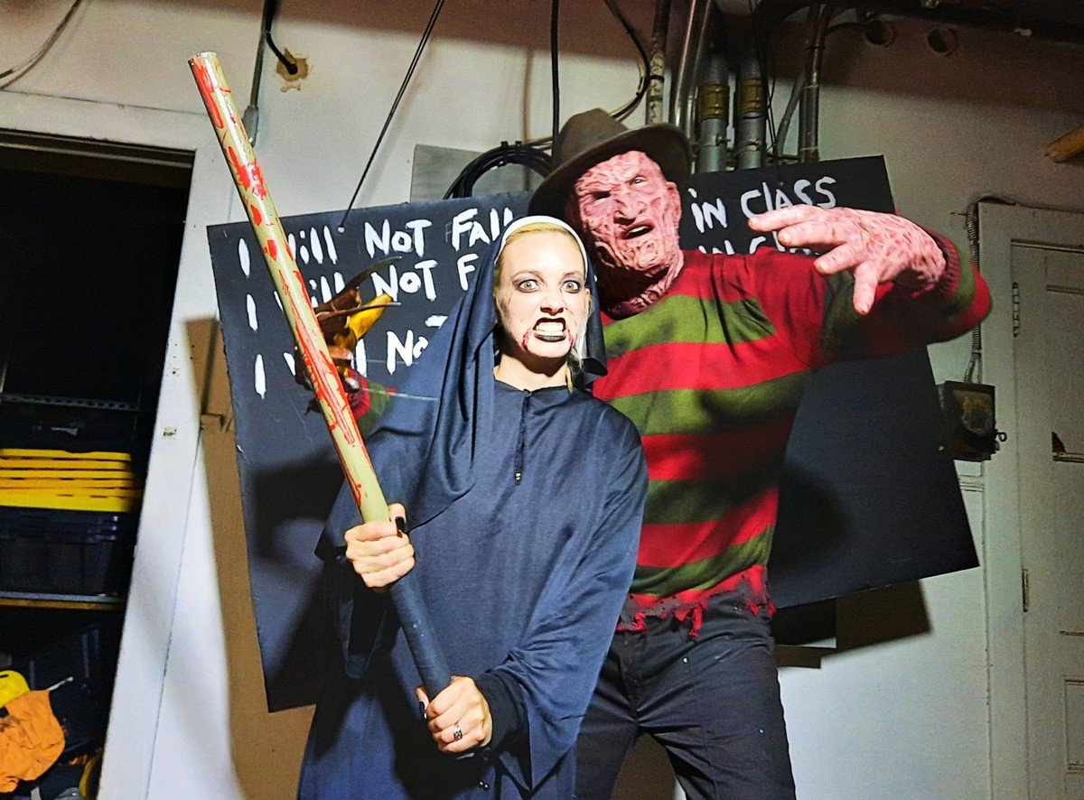 Portable haunted house trailer setting up for a spine-chilling Halloween experience