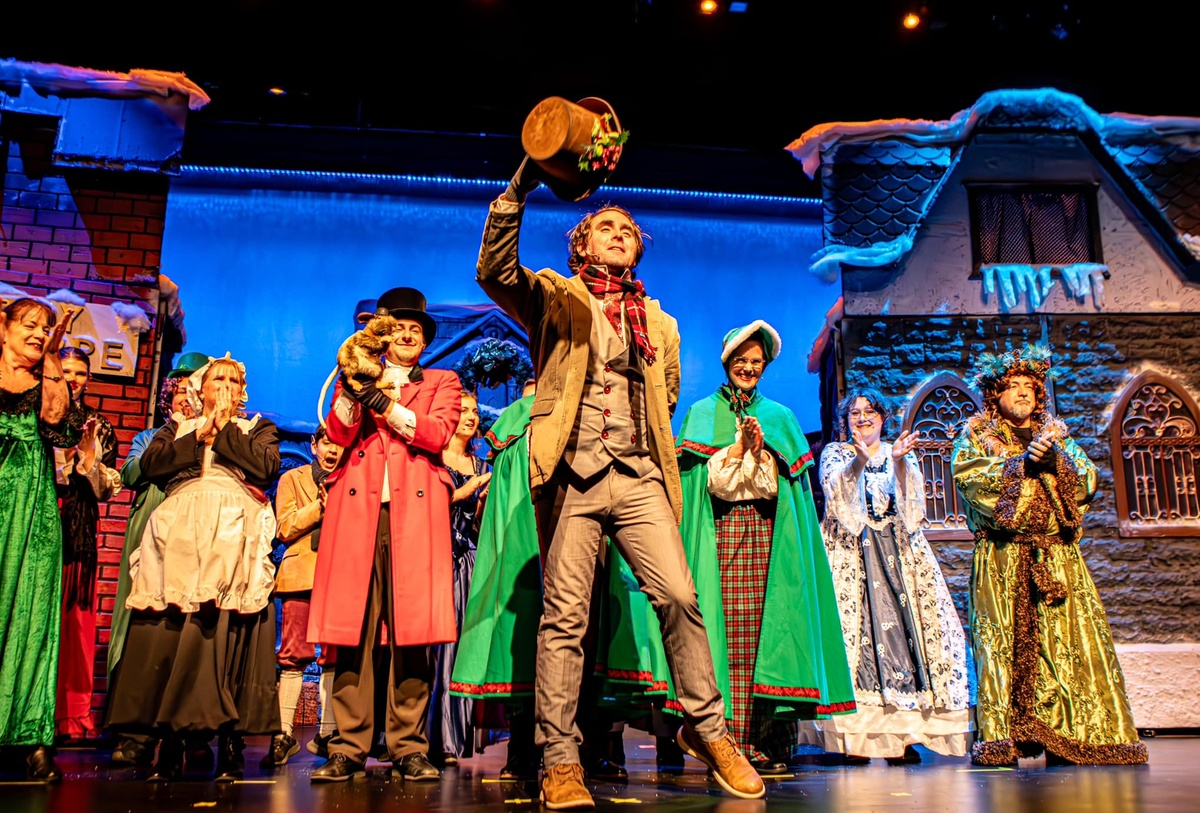 A powerful moment on stage during a touring mainstage show, featuring expressive performers.