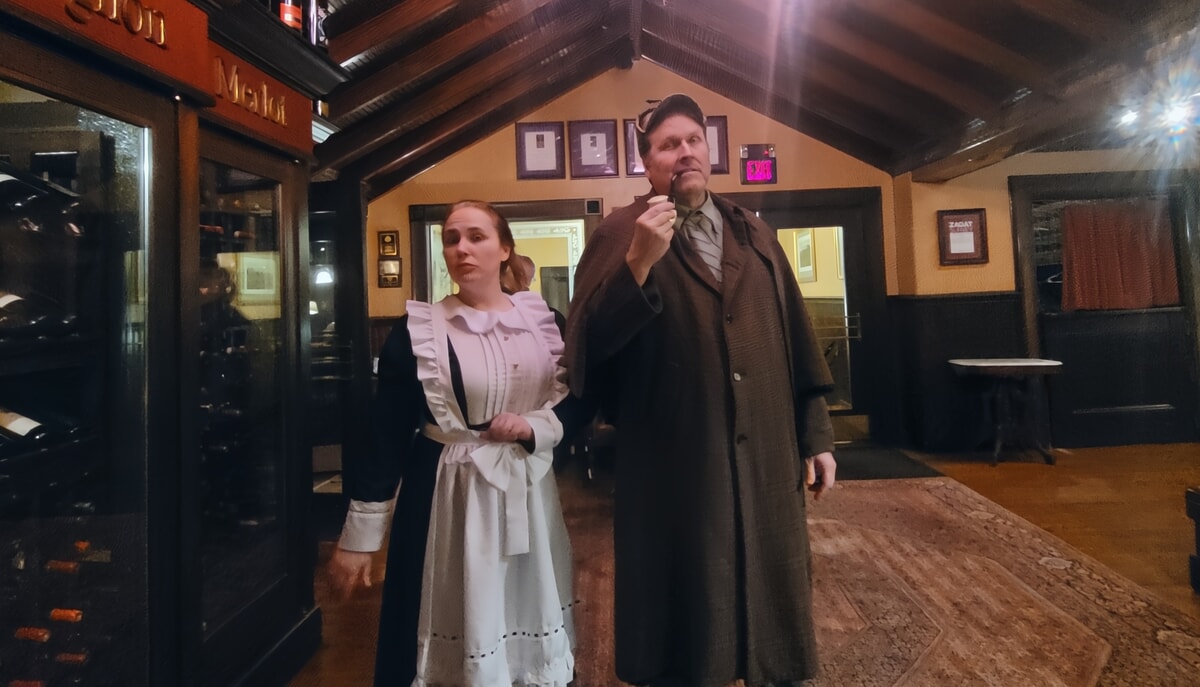 Live actors performing an interactive Maryland murder mystery dinner theater show.