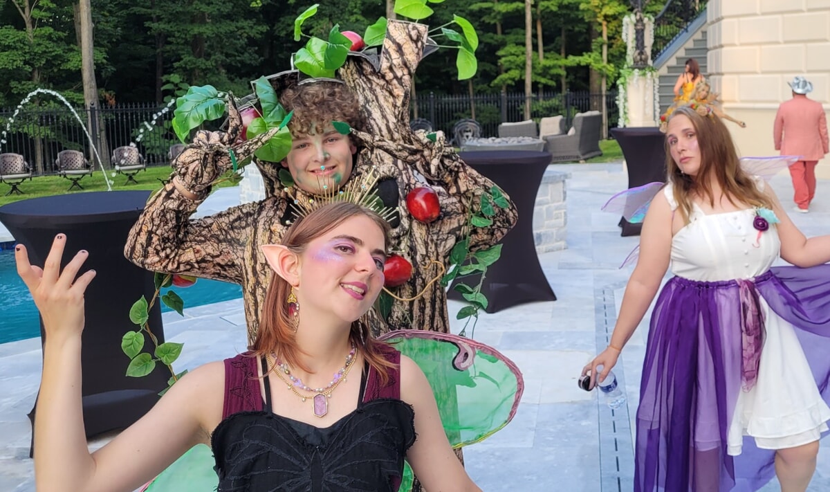 Theatrical performers in unique costumes presenting a custom-themed live show