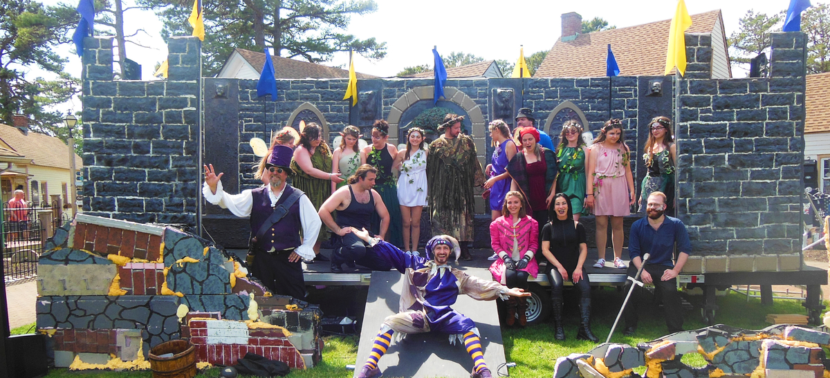 A dynamic festival scene in NJ with performers engaging the audience