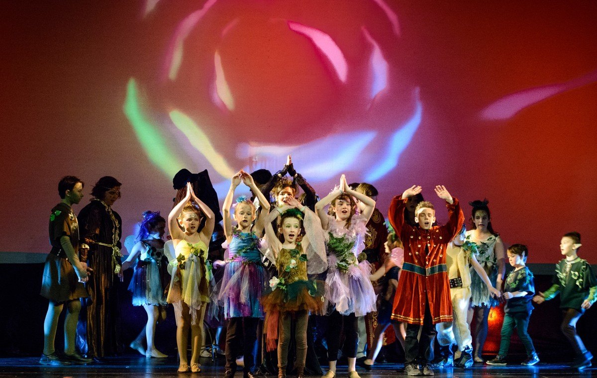 A touring mainstage show captivating an engaged audience with a stunning performance