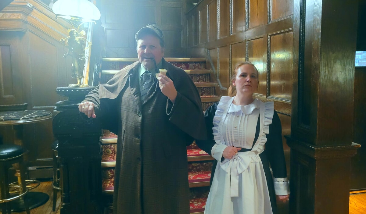 A detective character engages guests in a thrilling Maryland murder mystery event.