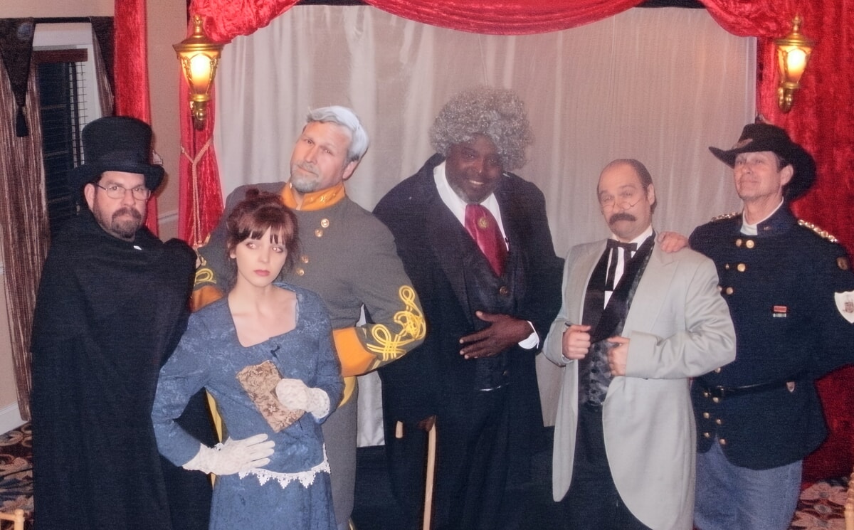 Stage performers in unique, custom-themed outfits captivating an audience