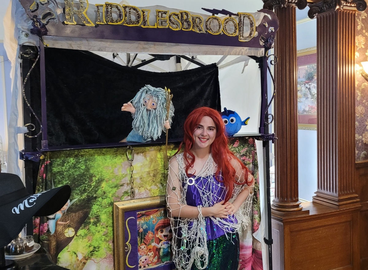 Actors performing in a touring kids' show, engaging young audiences with interactive storytelling
